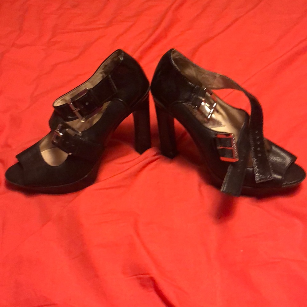 Black micheal Kors used heels size 7.5